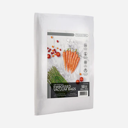 White vacuum-seal food storage bag with a label reading 'Universal Embossed Vacuum Bags' and a photo of carrots and asparagus on the front; indicates 50 bags included.