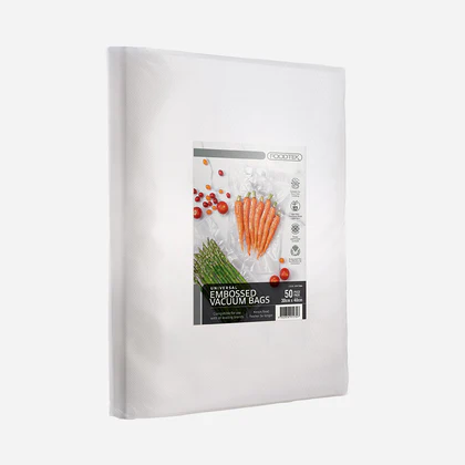 White vacuum food-storage bag in its packaging, with a label showing carrots and cherry tomatoes.