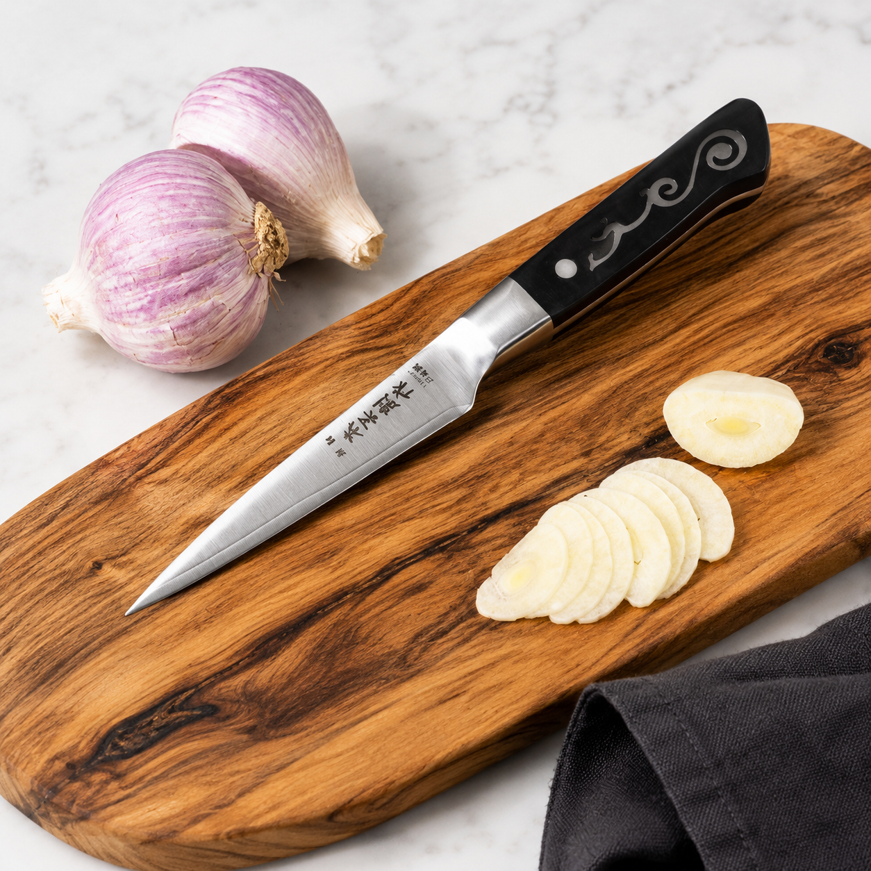 Two purple garlic bulbs on a wooden cutting board with a sharp knife and several garlic slices laid out on the board.
