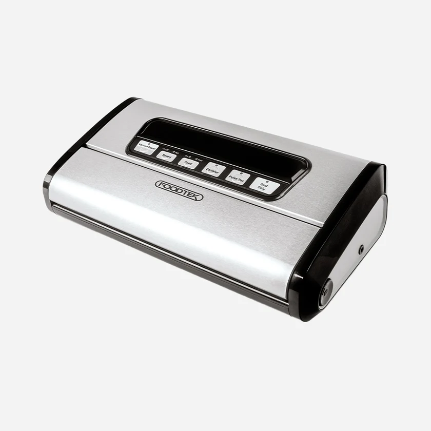 Silver and black FoodTex vacuum sealer with control panel on top, shown on a light background (kitchen appliance for sealing food bags).