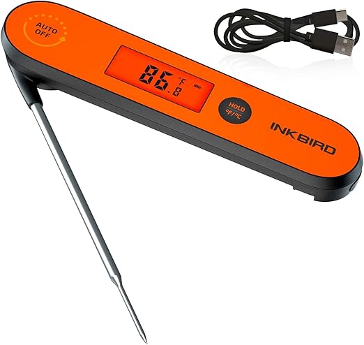 Orange Inkbird digital thermometer with a wired metal probe, display showing 86.6°F, and a USB cable nearby for charging or data transfer.