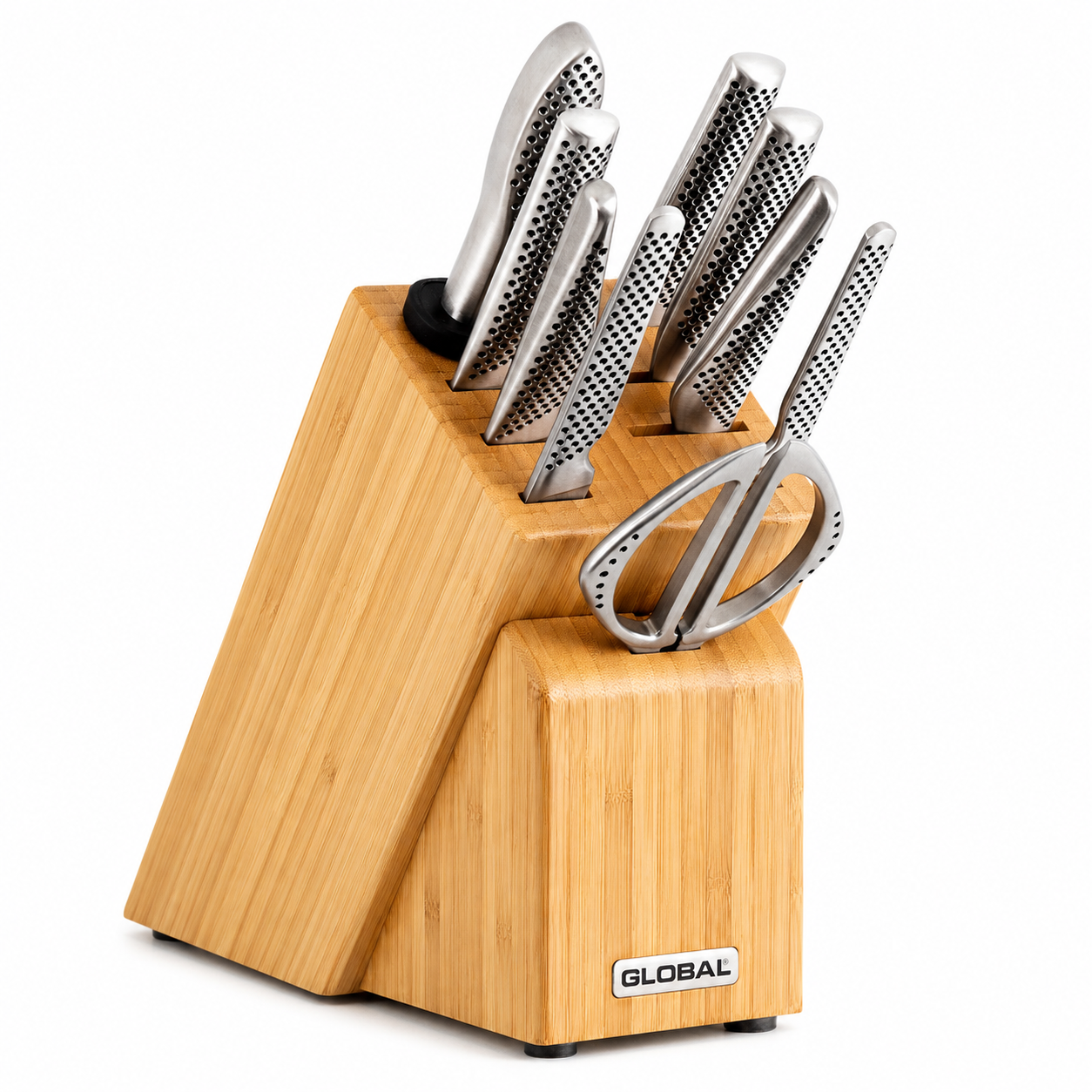 Wooden knife block holding multiple stainless steel kitchen knives and a pair of shears, brand GLOBAL visible